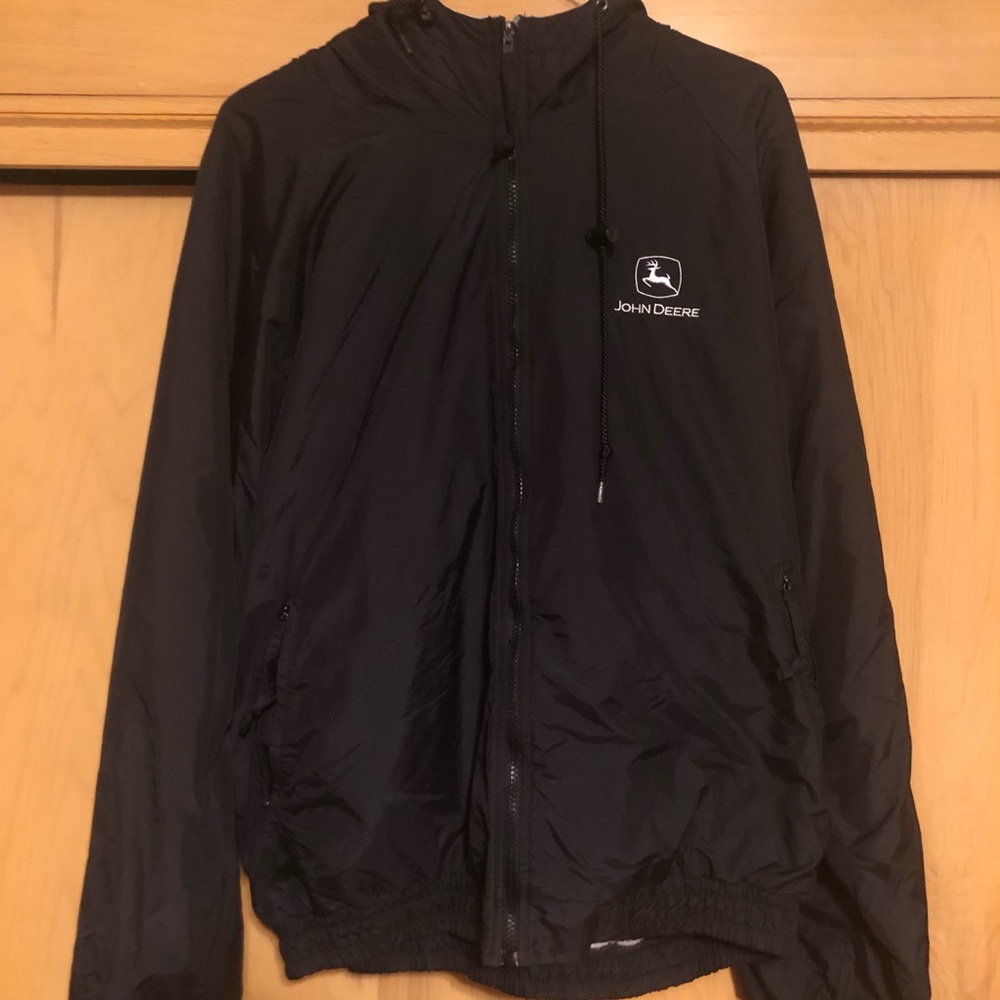 Black John Deere windbreaker.